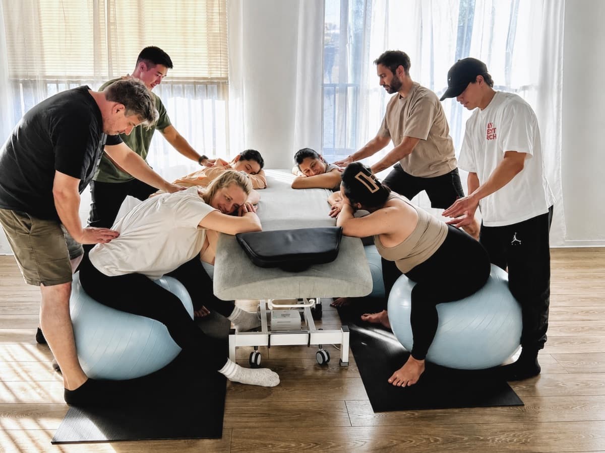 Couples working together during birth preparation workshop
