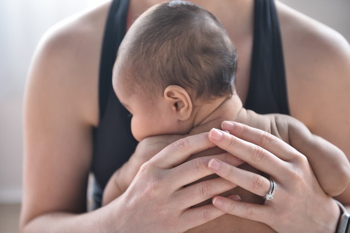Parent learning infant massage techniques on their baby in Lane Cove