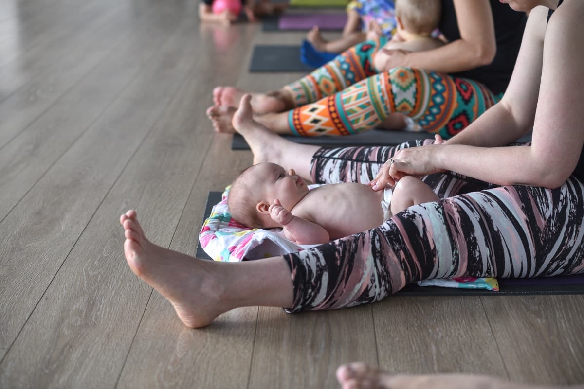 Parent learning infant massage techniques on their baby in Lane Cove