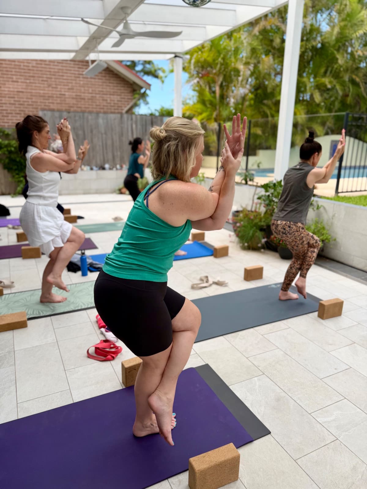 Women stretching during the energising yoga flow at the Evolvere retreat