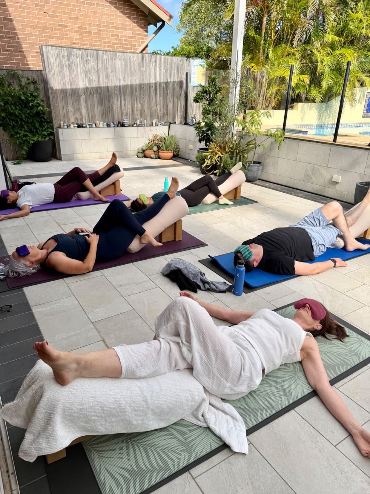Guided restorative yoga practice during the Eat Play Yoga retreat